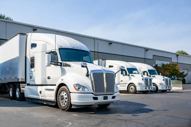 Trucks staged in a warehouse yard